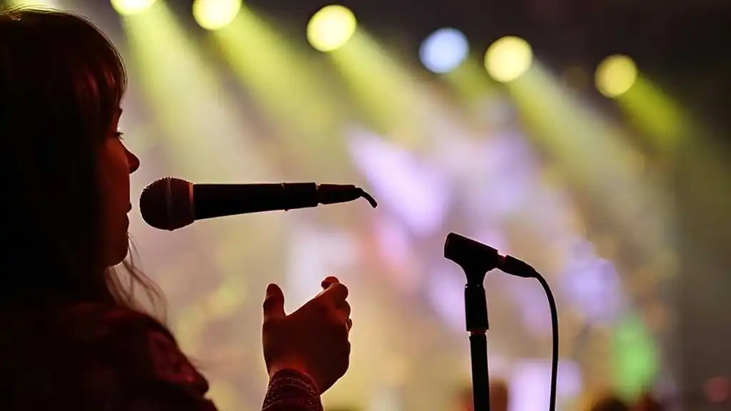 Woman singing into a karaoke microphone
