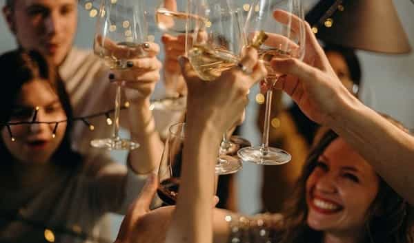 Guests raising their glasses making a toast