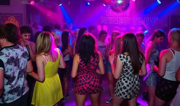 A packed dancefloor at a themed disco