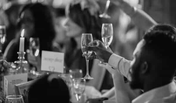 Guests making a toast to the married couple